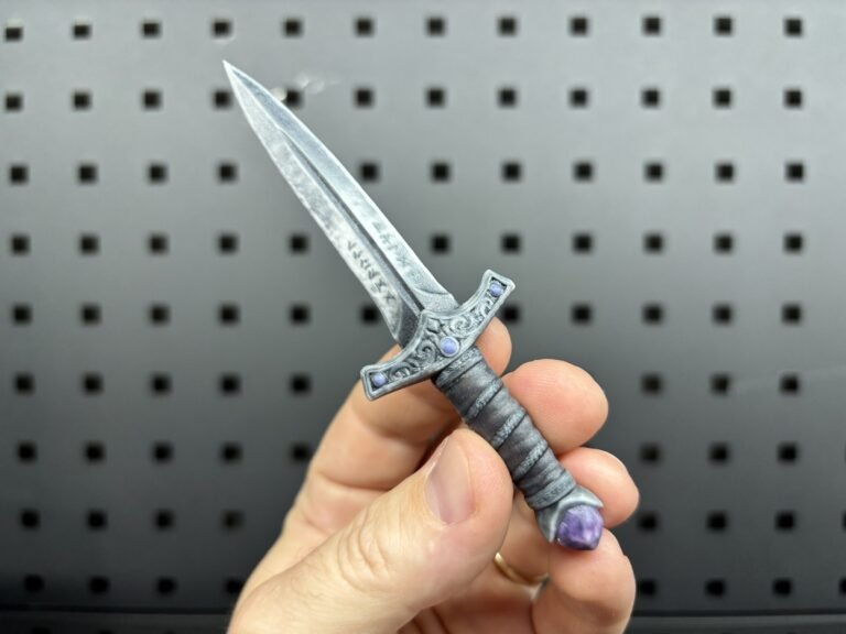 Full-colour 3D printed fantasy dagger with a stone-look blade and purple gem pommel
