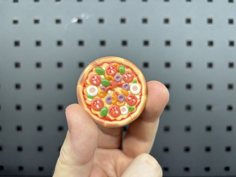 Small full-colour 3D printed pizza with toppings