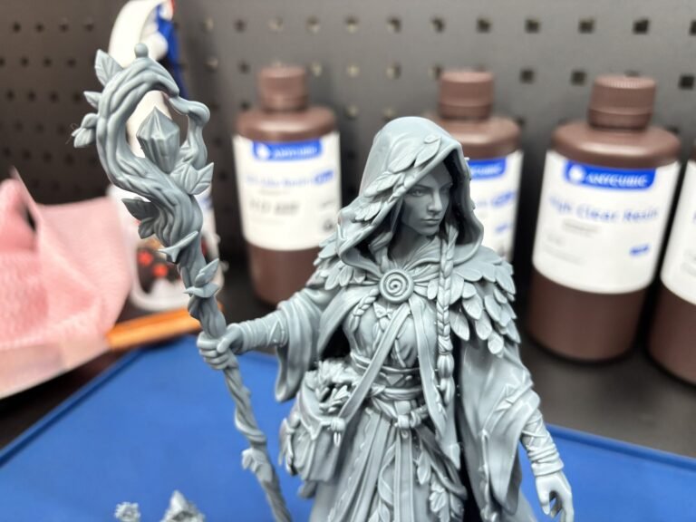 Close-up of a large grey resin 3D printed druid figure showing fine detail