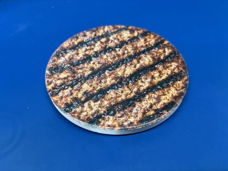 Round ceramic coaster UV printed with a grilled texture design