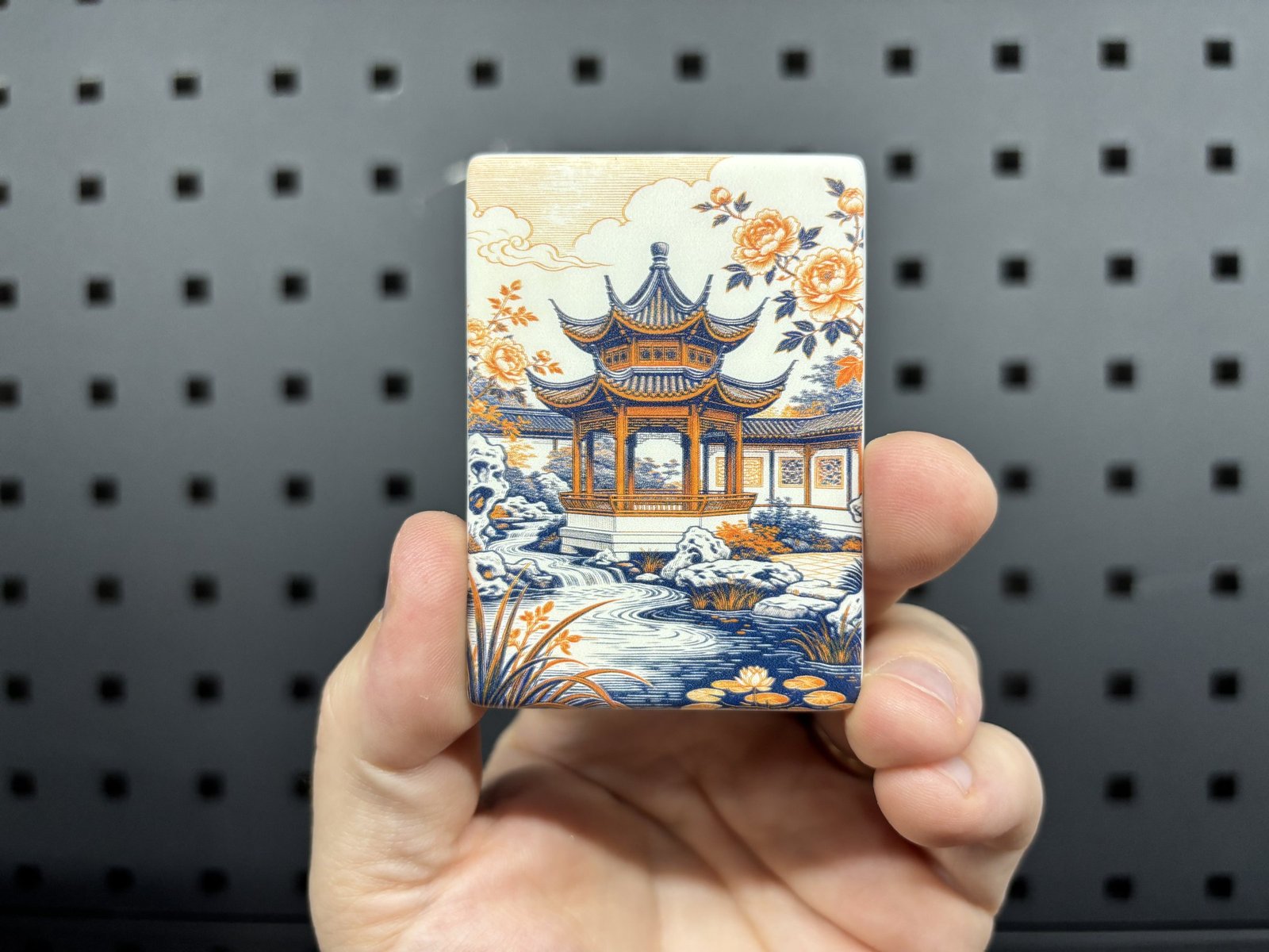 Rectangular fridge magnet UV printed with an orange and blue garden pavilion illustration